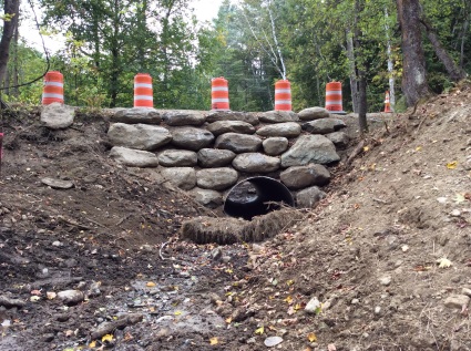Boulders to support and protect the culvert and the road